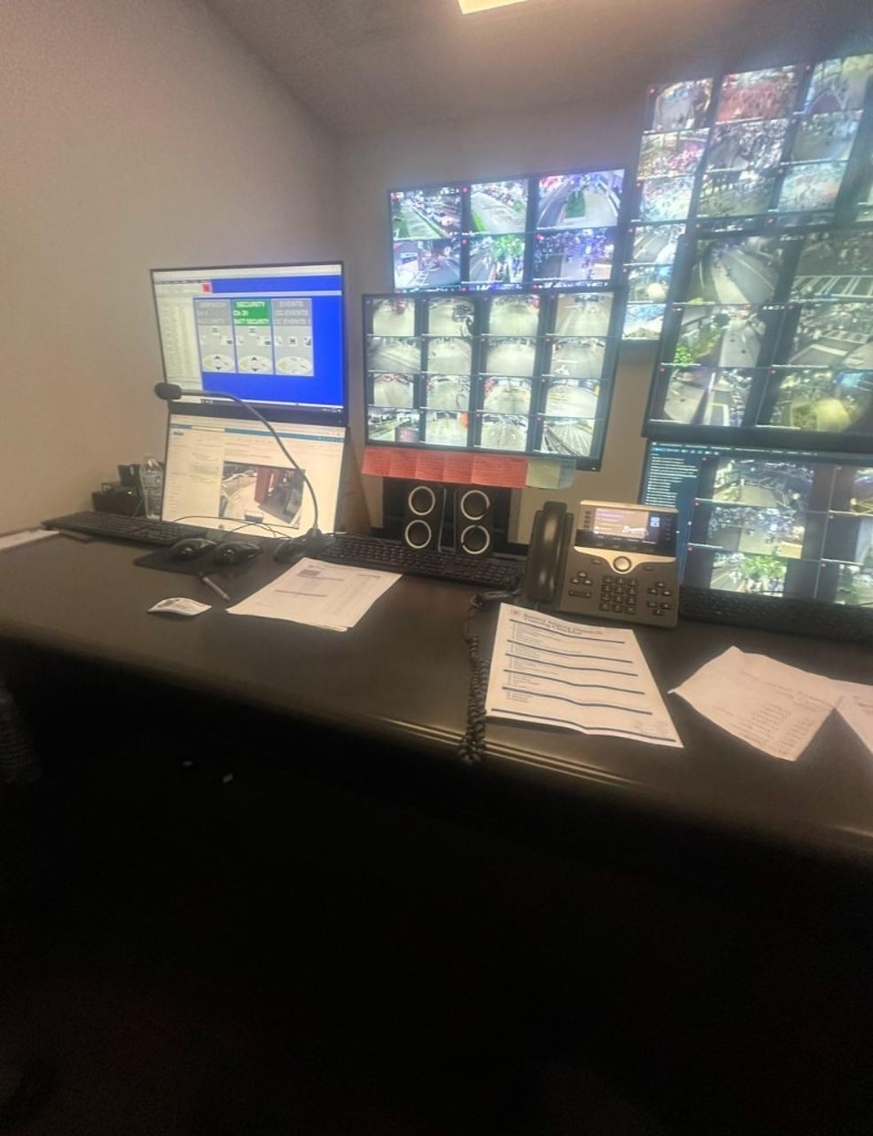 Atlanta Braves Safety Dispatcher desk — multi-monitor security feeds and Braves phone